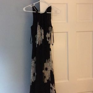 Knee length black floral dress.